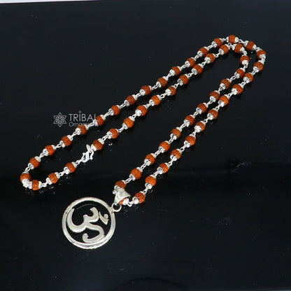 925 sterling silver OM mantra pendant with Rudraksha chain, handmade tribal jewelry for spiritual protection and positive energy.