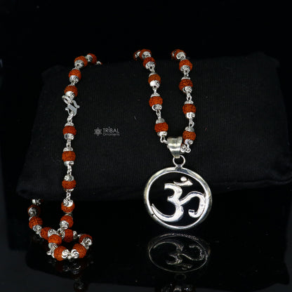925 sterling silver OM mantra pendant on Rudraksha chain, handmade jewelry for spiritual protection and positive energy.