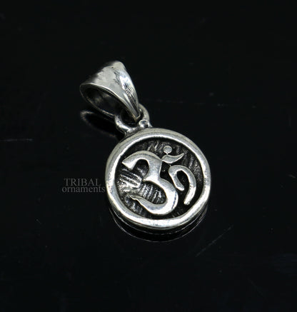925 sterling silver 'Aum' OM pendant from TRIBAL ORNAMENTS, handmade tribal jewelry with divine and good luck symbolism.