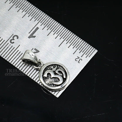 925 sterling silver 'Aum' OM pendant by TRIBAL ORNAMENTS, handmade tribal jewelry with a divine, stylish design for good luck.
