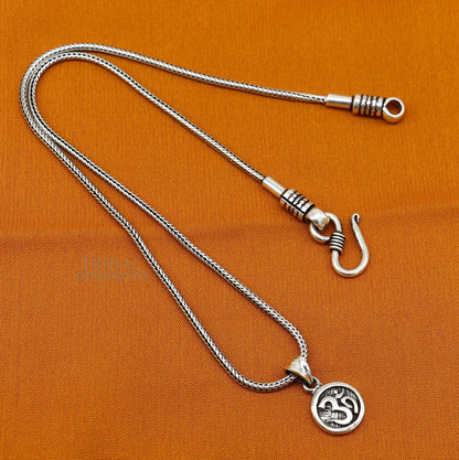925 sterling silver 'Aum' OM pendant by TRIBAL ORNAMENTS, handcrafted tribal jewelry with divine symbol and stylish good luck design.