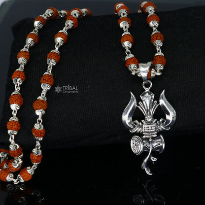 Sterling silver Shiva trident pendant with Rudraksha chain, handmade tribal jewelry representing divine protection and spiritual energy.