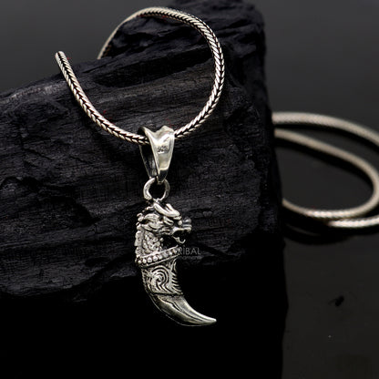 925 sterling silver dragon tooth pendant by TRIBAL ORNAMENTS, featuring a handcrafted mythical dragon tooth symbol of power and resilience.