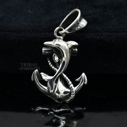 925 sterling silver dolphin with anchor pendant from TRIBAL ORNAMENTS, showcasing elegant good luck jewelry with detailed craftsmanship.