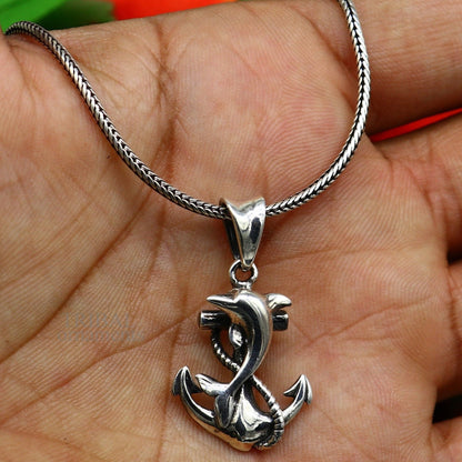 925 sterling silver dolphin with anchor pendant from TRIBAL ORNAMENTS, showcasing elegant good luck jewelry craftsmanship.