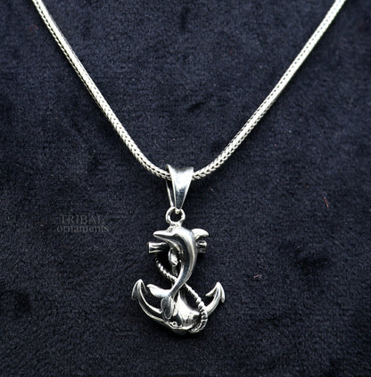 925 sterling silver dolphin and anchor pendant by TRIBAL ORNAMENTS, elegant good luck jewelry with intricate handcrafted details.