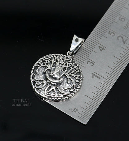 Sterling silver handmade Ganesha pendant by Tribal Ornaments, stylish unisex tribal jewelry with intricate idol design.