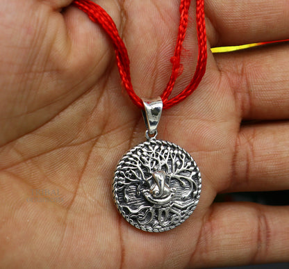 Sterling silver handmade Ganesha pendant by TRIBAL ORNAMENTS, stylish unisex tribal jewelry with intricate design.