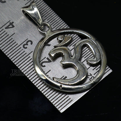 Sterling silver Hindu mantra Aum OM pendant by TRIBAL ORNAMENTS, featuring intricate tribal design and personalized good luck symbolism.