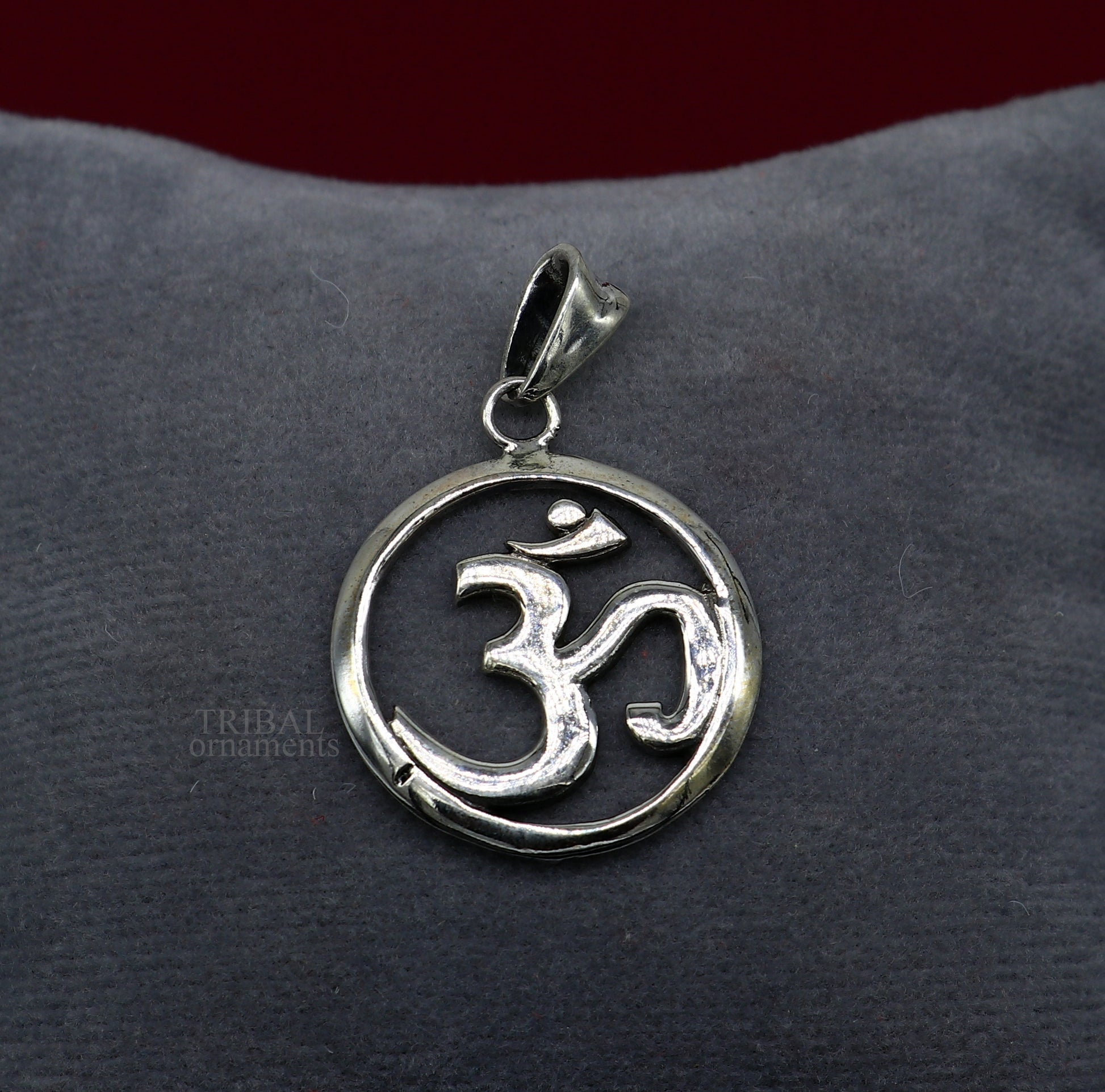 Sterling silver Hindu mantra Aum OM pendant by TRIBAL ORNAMENTS, showcasing intricate handcrafted tribal jewelry with good luck symbolism.