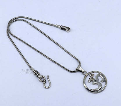 Sterling silver Hindu mantra Aum OM pendant by TRIBAL ORNAMENTS, featuring intricate tribal design and personalized good luck symbol.