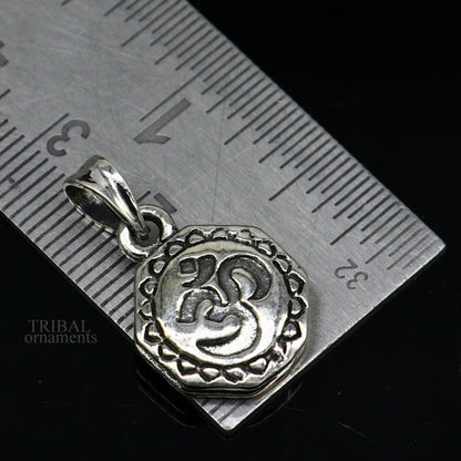 Sterling silver Hindu mantra Aum OM pendant from TRIBAL ORNAMENTS, featuring handmade tribal jewelry with good luck symbols.