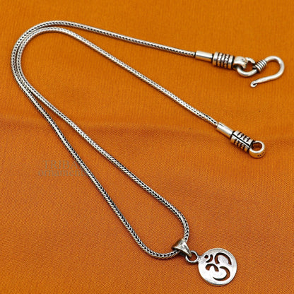 Sterling silver Hindu mantra 'Aum' OM pendant, unisex personalized jewelry, handmade tribal-style pendant with intricate design.