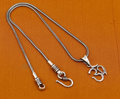 Sterling silver unisex Aum OM pendant featuring Hindu mantra, handmade tribal jewelry design by TRIBAL ORNAMENTS.