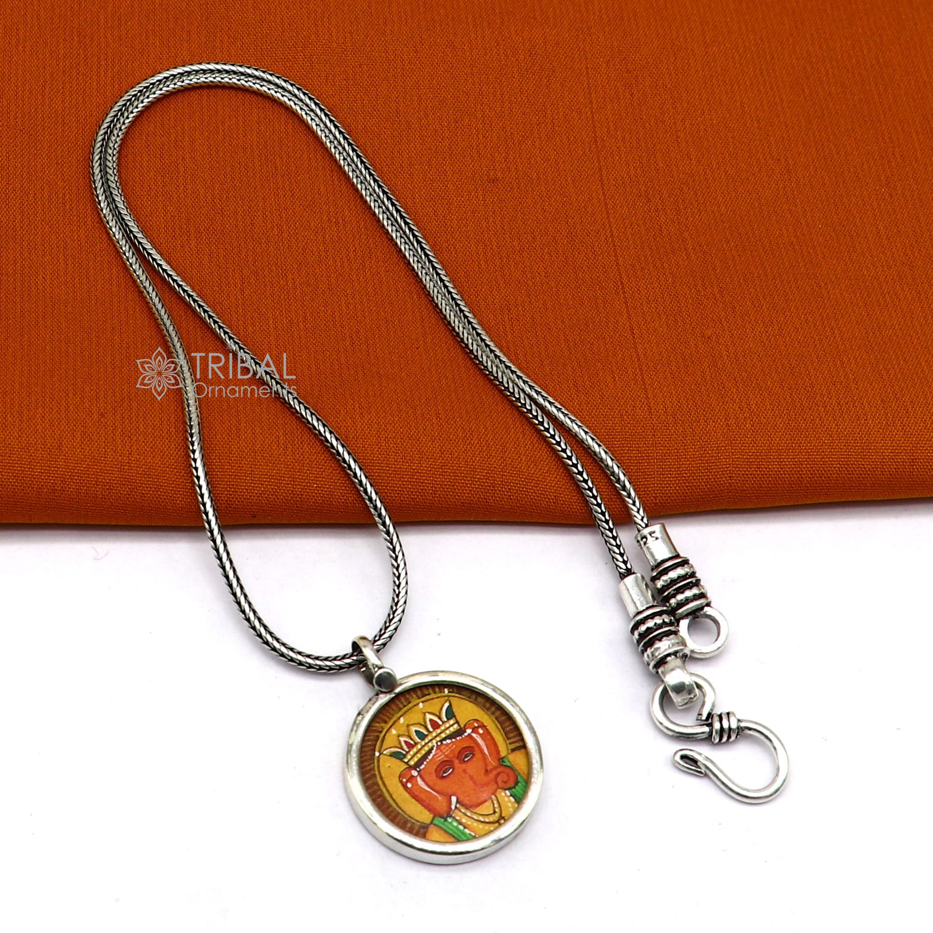 Sterling silver handmade Ganesha pendant featuring divine Lord painting, unisex jewelry gift from Tribal Ornaments.