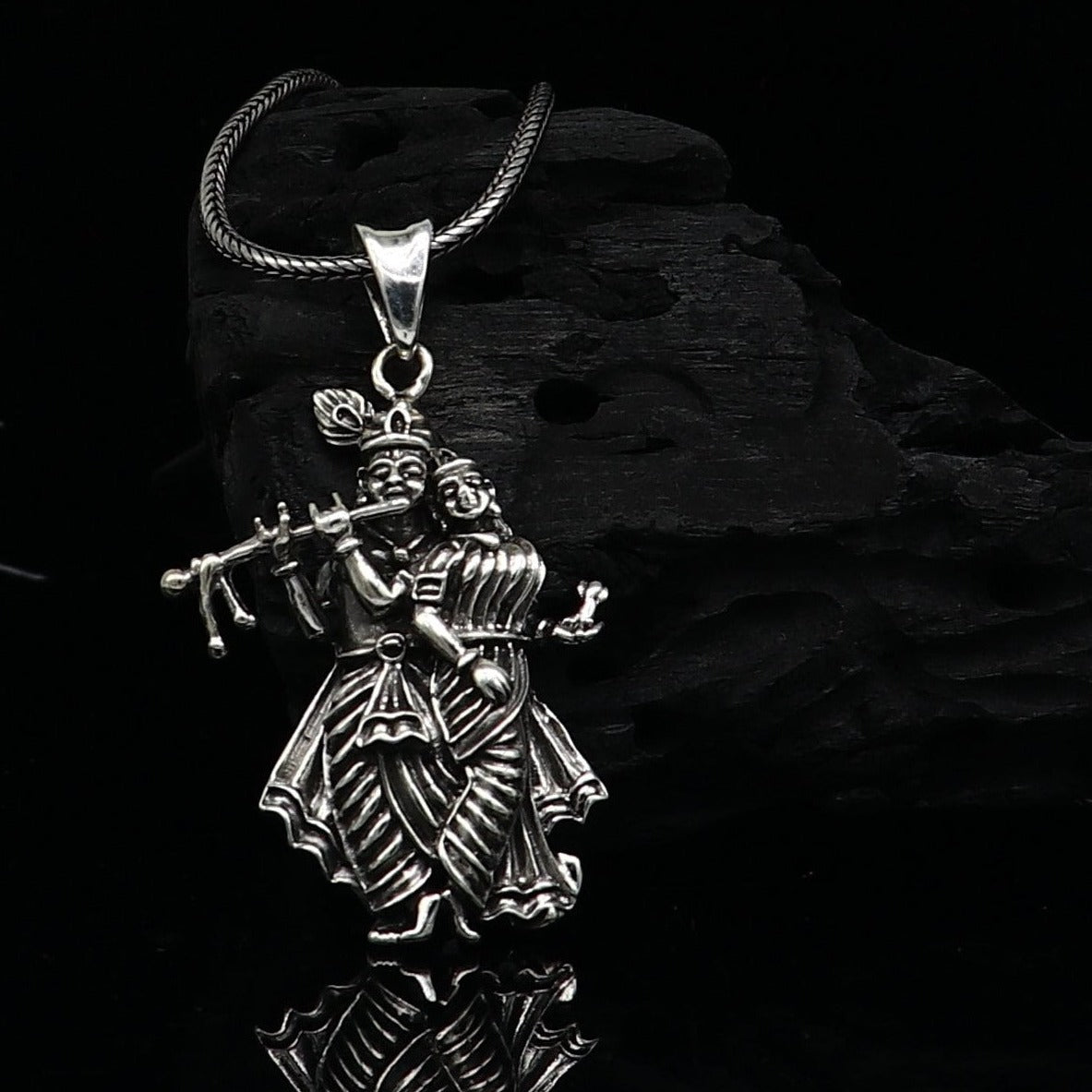 Tiny handmade Radha Krishna pendant in 925 sterling silver, unisex tribal jewelry, personalized idol pendant from Tribal Ornaments.