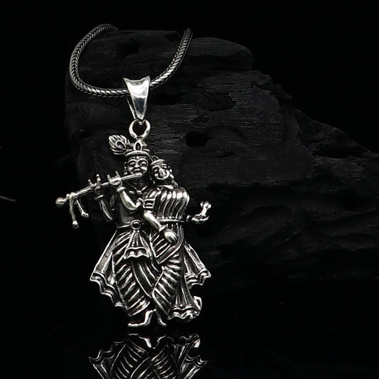 Tiny handmade Radha Krishna pendant in 925 sterling silver, unisex tribal jewelry, personalized idol pendant from Tribal Ornaments.