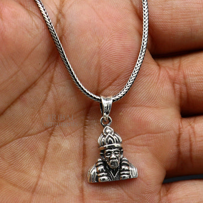 Sterling silver Sai Baba pendant by Tribal Ornaments, unisex handmade Indian jewelry with intricate design and personalized style.