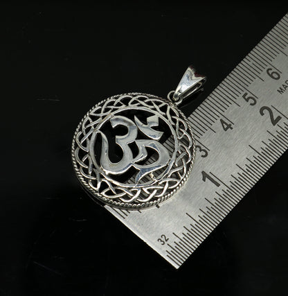 Sterling silver Aum OM pendant featuring handmade mantra symbol, unisex jewelry, stylish and personalized by TRIBAL ORNAMENTS.
