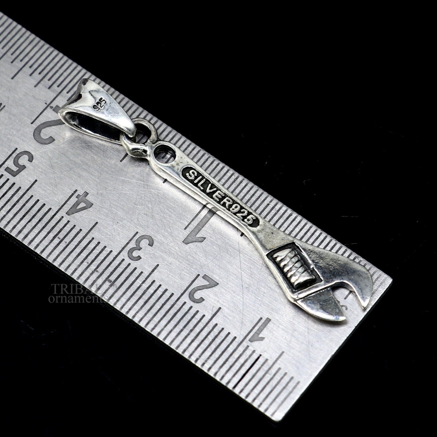 925 sterling silver tool spanner pendant by TRIBAL ORNAMENTS, unisex handmade jewelry with intricate spanner design.