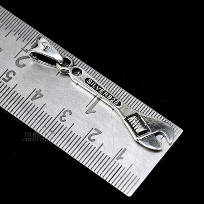 925 sterling silver tool spanner pendant by TRIBAL ORNAMENTS, unisex handmade jewelry with intricate spanner design.
