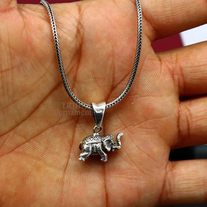 Small sterling silver elephant pendant by TRIBAL ORNAMENTS, handmade jewelry, perfect for gifting or divine lucky necklace.