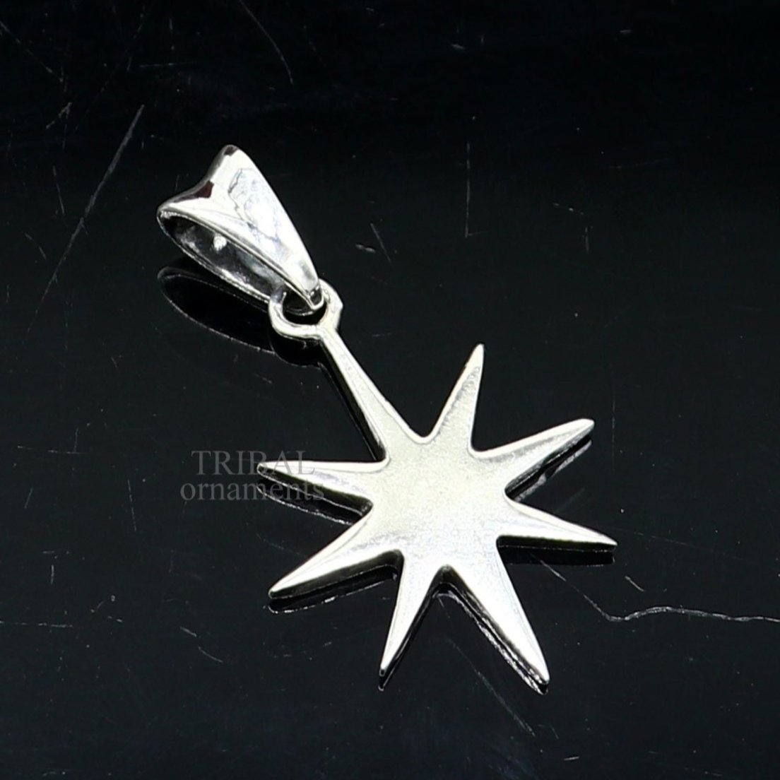 Unisex 925 sterling silver star pendant by Tribal Ornaments, handmade elegant jewelry with a smooth, plain silver finish.