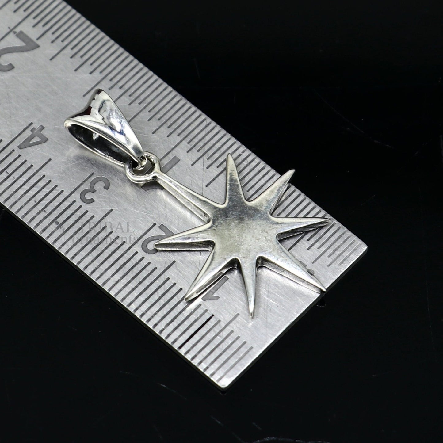 Elegant 925 sterling silver star pendant by TRIBAL ORNAMENTS, unisex handmade jewelry with a sleek, plain silver design.
