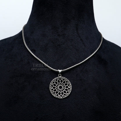 Sterling silver floral design pendant from TRIBAL ORNAMENTS, handmade round jewelry piece ideal for gifting.