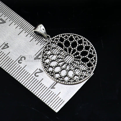 Sterling silver floral round pendant by TRIBAL ORNAMENTS, handmade stylish jewelry perfect for gifting from India.