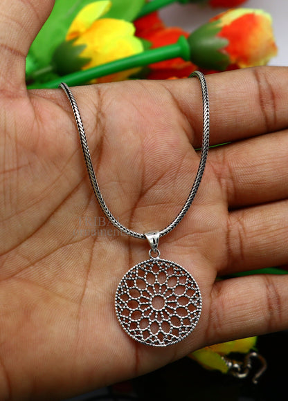 Sterling silver floral round pendant by TRIBAL ORNAMENTS, handmade stylish jewelry, perfect for gifting and Indian jewelry collection.
