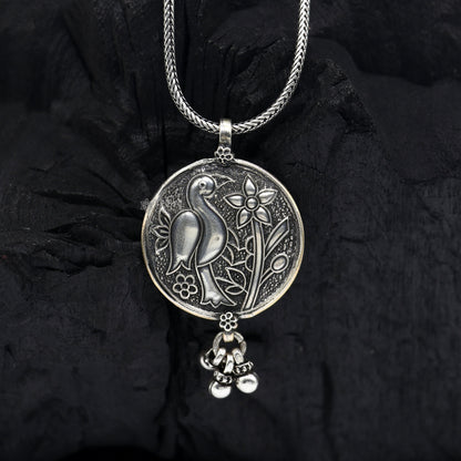 Handmade vintage sterling silver peacock pendant with hanging drops, traditional Indian tribal jewelry design.