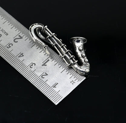 925 sterling silver small trumpet pendant from TRIBAL ORNAMENTS, detailed musical instrument jewelry for gift or collection.