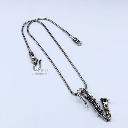 Small 925 sterling silver trumpet pendant from TRIBAL ORNAMENTS, detailed musical instrument jewelry for gift or collection.