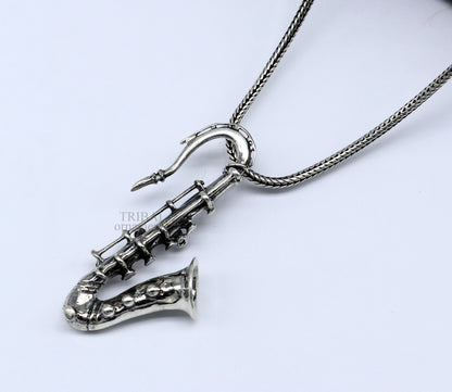 Sterling silver small trumpet pendant by Tribal Ornaments, detailed musical instrument jewelry for gift or personal adornment.