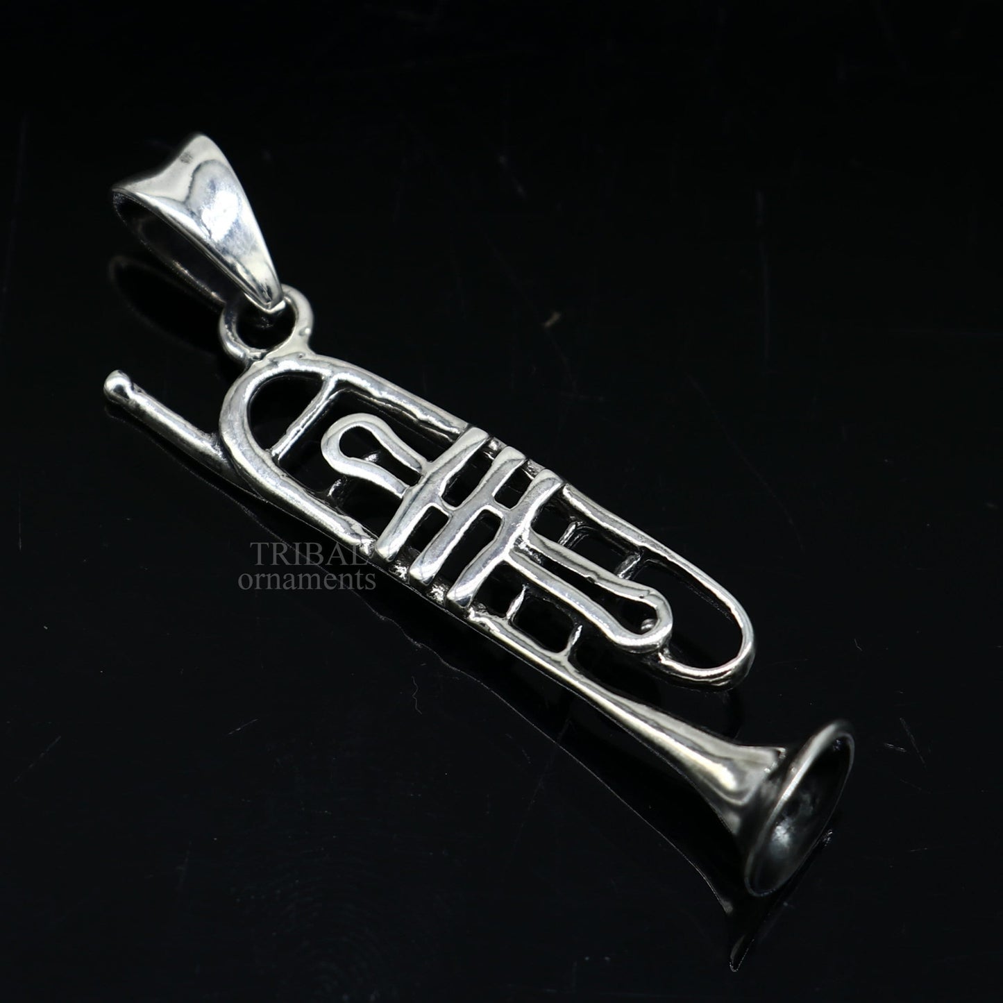 Sterling silver trumpet pendant by TRIBAL ORNAMENTS, detailed musical instrument jewelry for gift or collection.