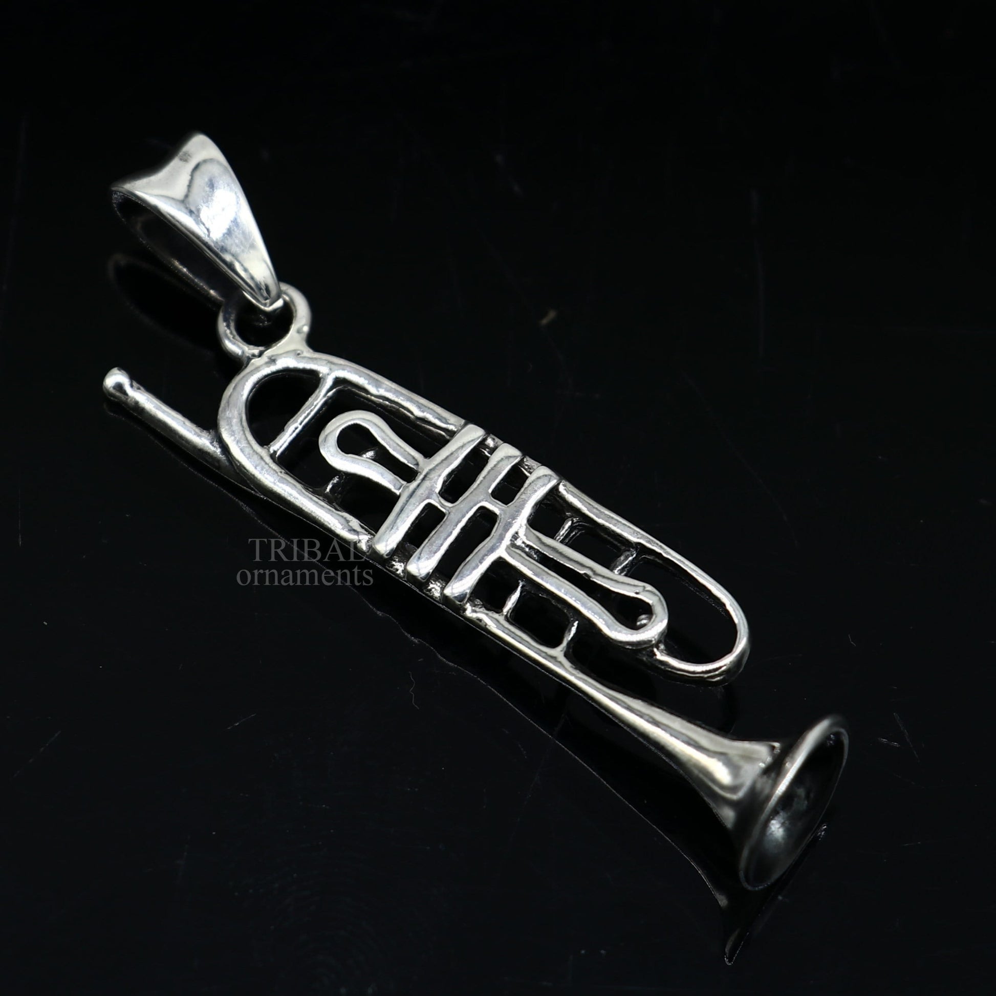 Sterling silver trumpet pendant by TRIBAL ORNAMENTS, detailed musical instrument jewelry for gift or collection.
