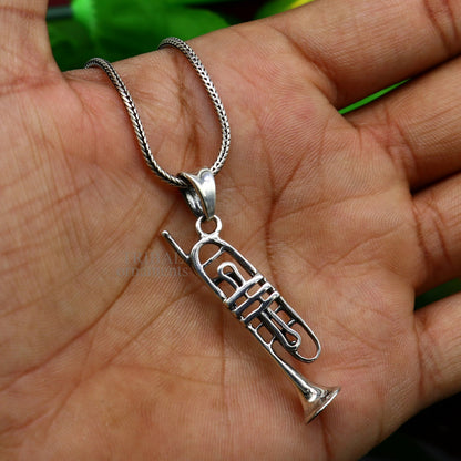 Sterling silver trumpet pendant by TRIBAL ORNAMENTS, small musical instrument jewelry for necklaces or gifts.