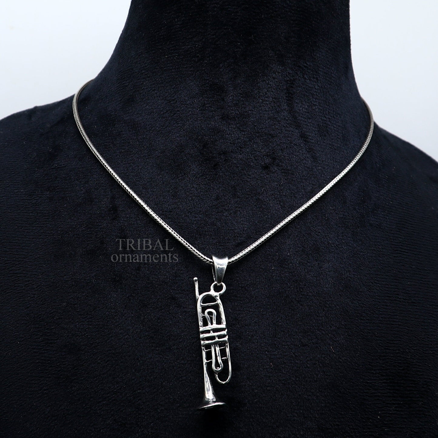Sterling silver trumpet pendant by TRIBAL ORNAMENTS, small musical instrument jewelry, detailed trumpet or cornet design.