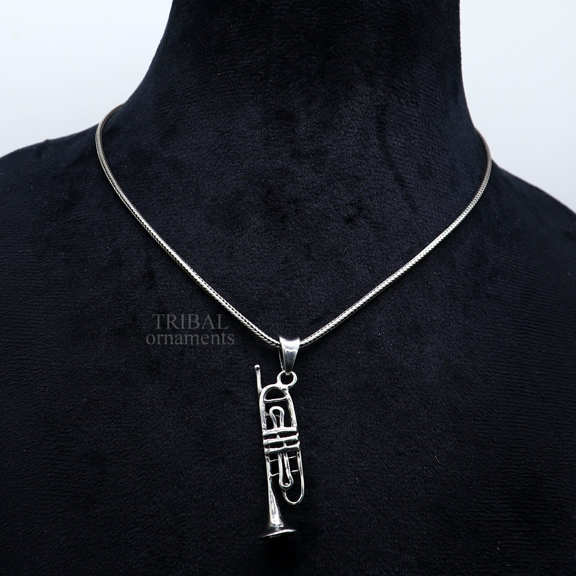 Sterling silver trumpet pendant by TRIBAL ORNAMENTS, small musical instrument jewelry, detailed trumpet or cornet design.