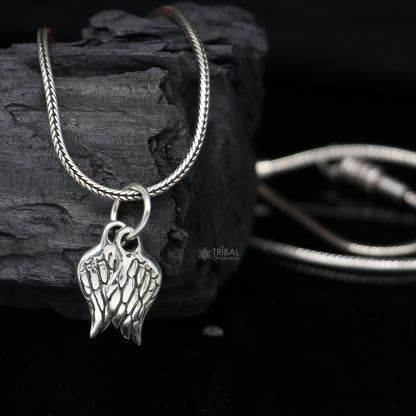 925 sterling silver bird wing pendant with detailed feather design, angel wing style jewelry from TRIBAL ORNAMENTS.