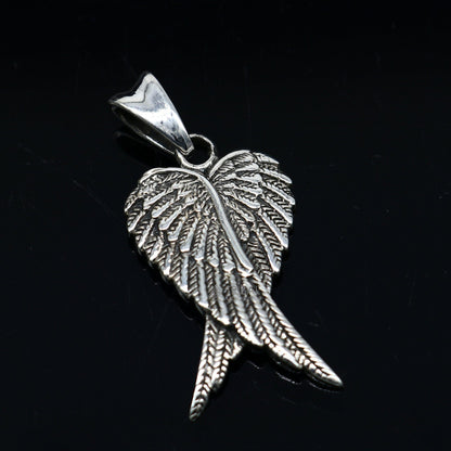 925 sterling silver bird wing pendant, tribal animal jewelry featuring detailed feather design on a silver necklace.