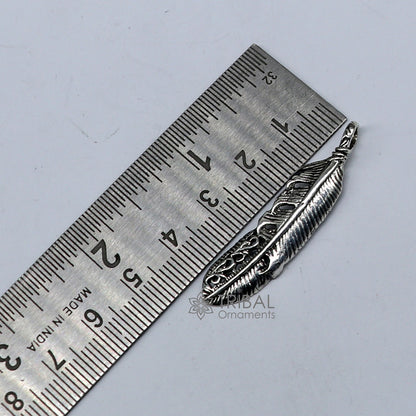 Sterling silver bird wing pendant by TRIBAL ORNAMENTS, featuring a detailed feather design in animal jewelry style.