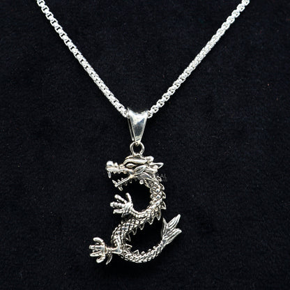925 sterling silver dragon pendant necklace by TRIBAL ORNAMENTS, unisex tribal design with intricate cultural dragon detail.
