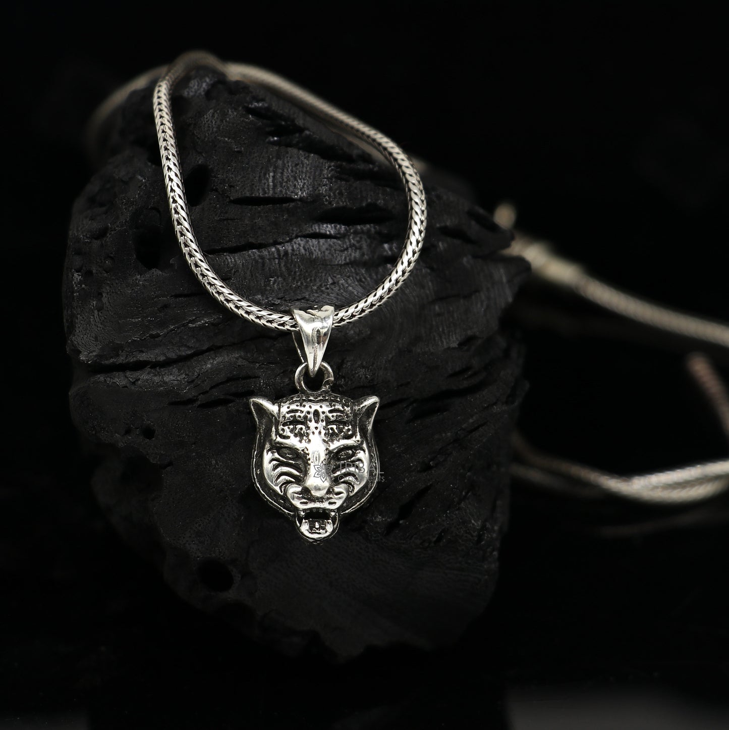 925 sterling silver lion face pendant from Tribal Ornaments, detailed animal jewelry with a fierce lion's head design.