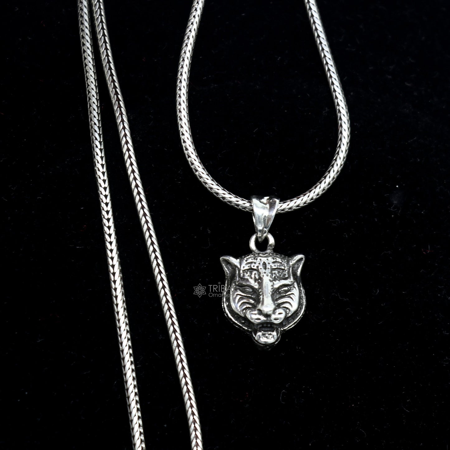 925 sterling silver lion face pendant from Tribal Ornaments, detailed animal jewelry featuring a fierce lion head design.