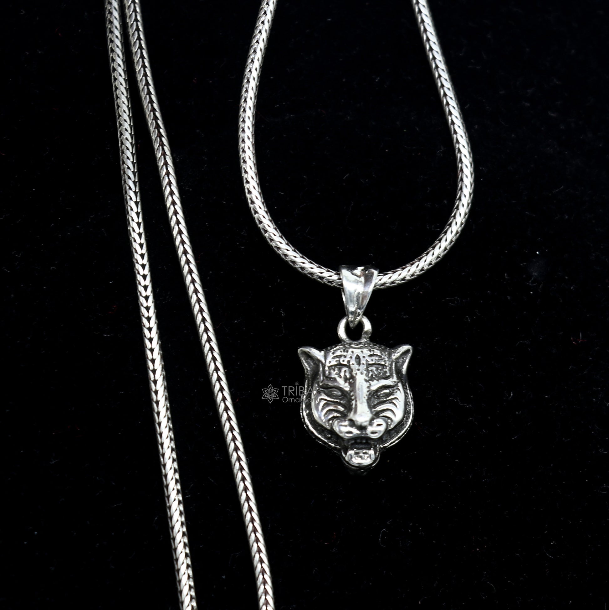 925 sterling silver lion face pendant from Tribal Ornaments, detailed animal jewelry featuring a fierce lion head design.