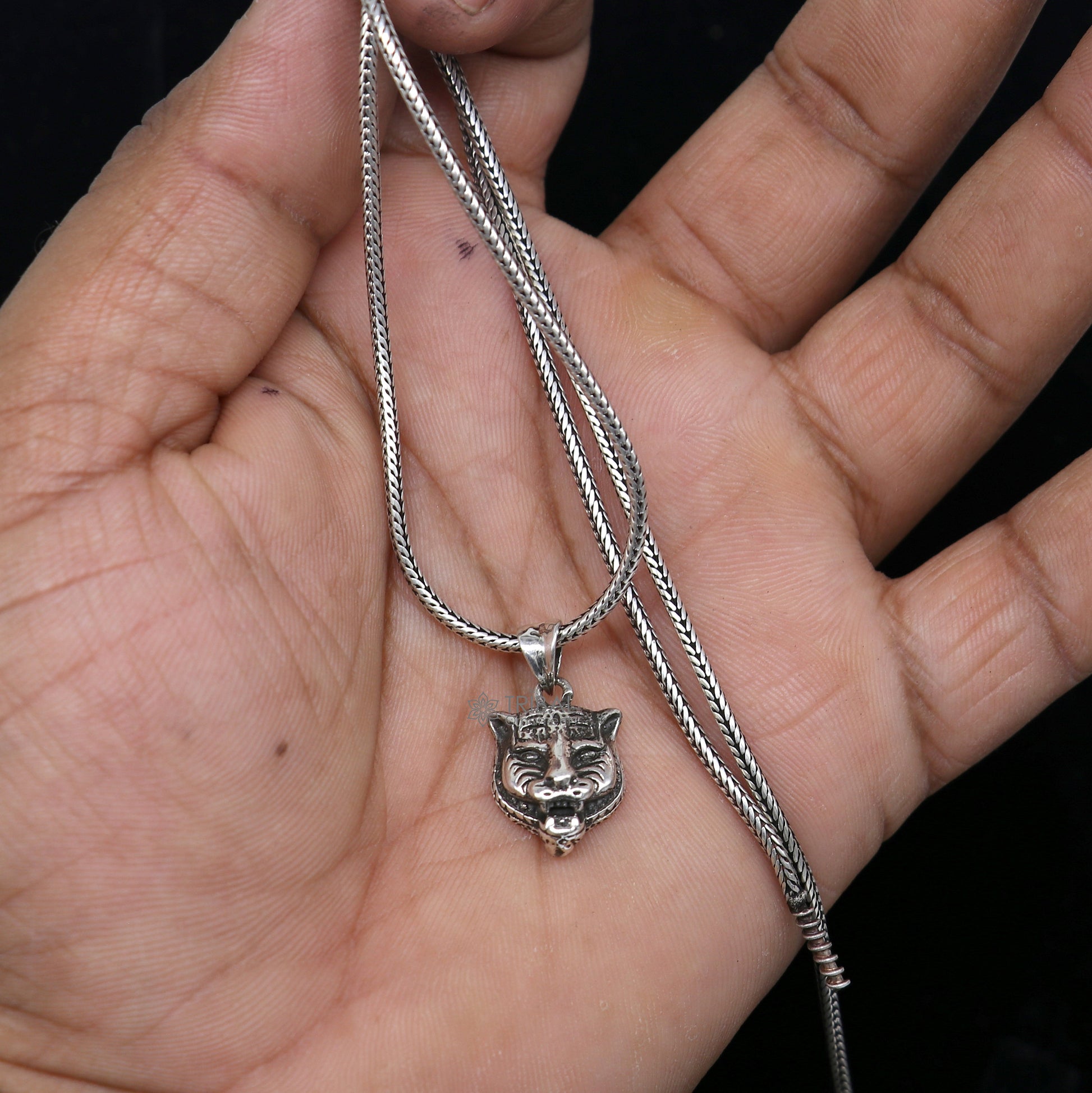 925 sterling silver lion face pendant from Tribal Ornaments, detailed animal jewelry featuring a bold lion head design.