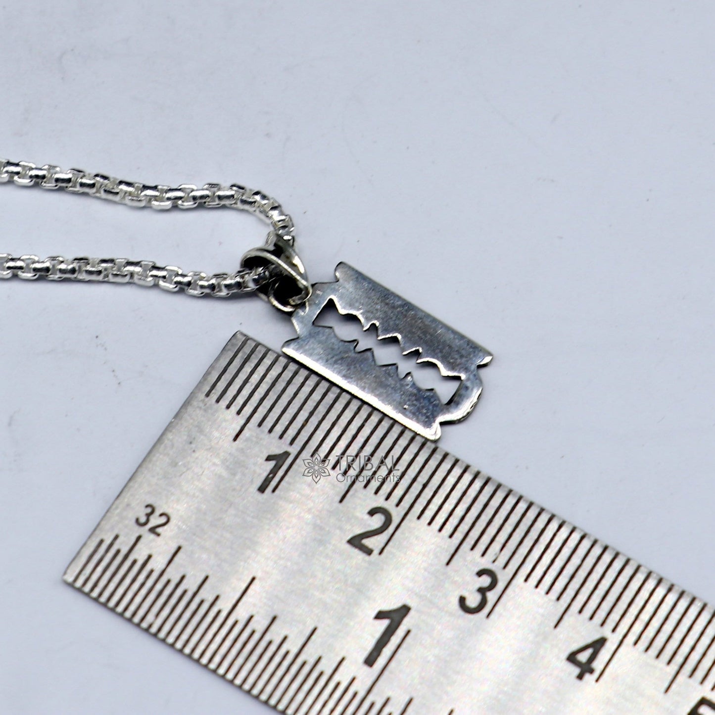 Sterling silver Razor Blade pendant by TRIBAL ORNAMENTS, unisex jewelry with a unique, edgy design for trendy cultural accessorizing.