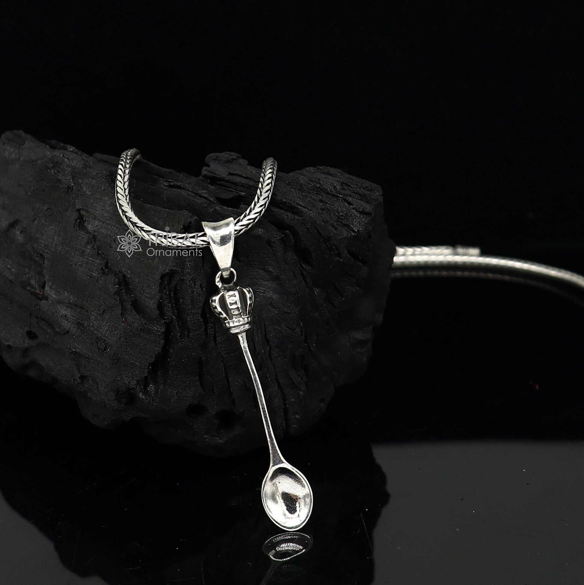 Sterling silver men's pendant with a unique spoon design from TRIBAL ORNAMENTS, showcasing intricate craftsmanship and modern style.